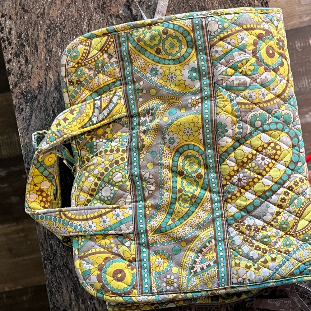 green vera bradley bag with a lot of storage